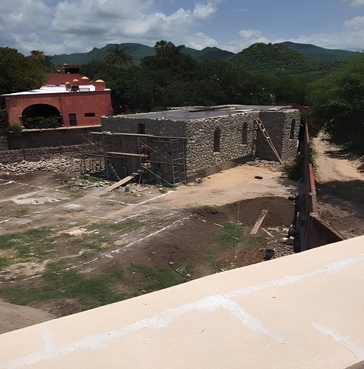 Hacienda restoration under way with mountains behind